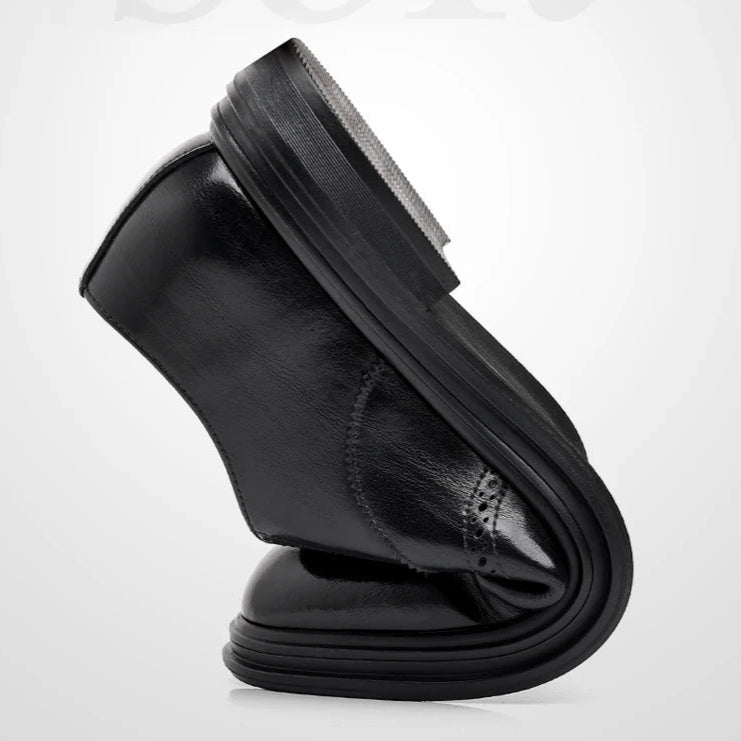 Black leather shoe on a white background