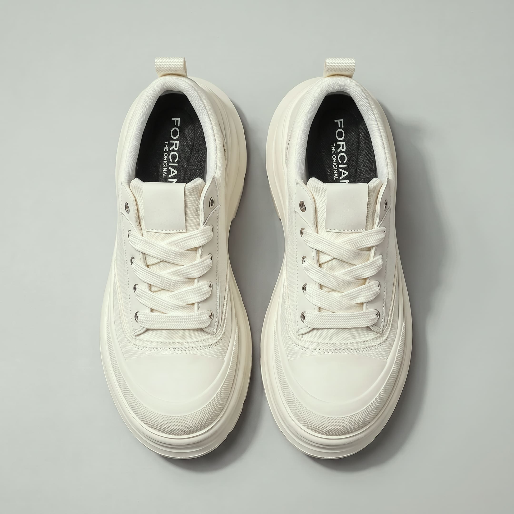 Top view of FORCIANO ATLAS Beige White elevator sneakers showing the lace-up canvas and leather uppers and contrasting Black insoles.