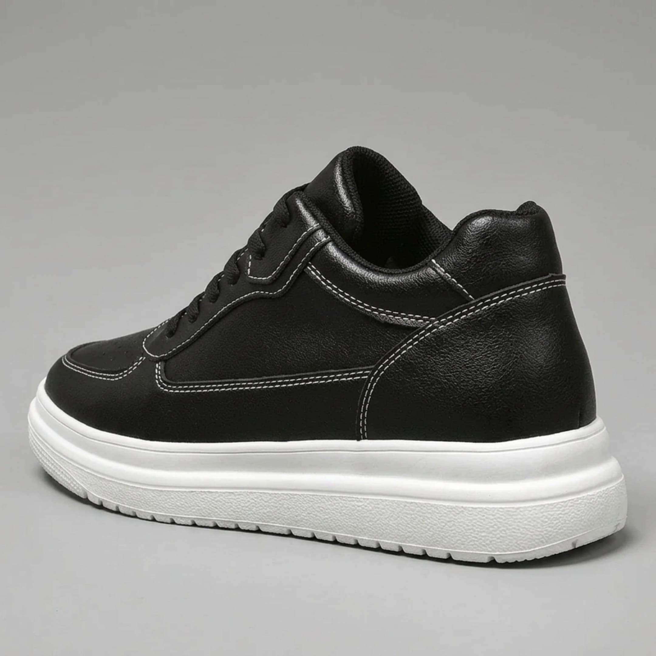 FORCIANO AVERY black height increasing sneaker for women in rear three-quarter view, showing the premium leather upper and white raised sole.
