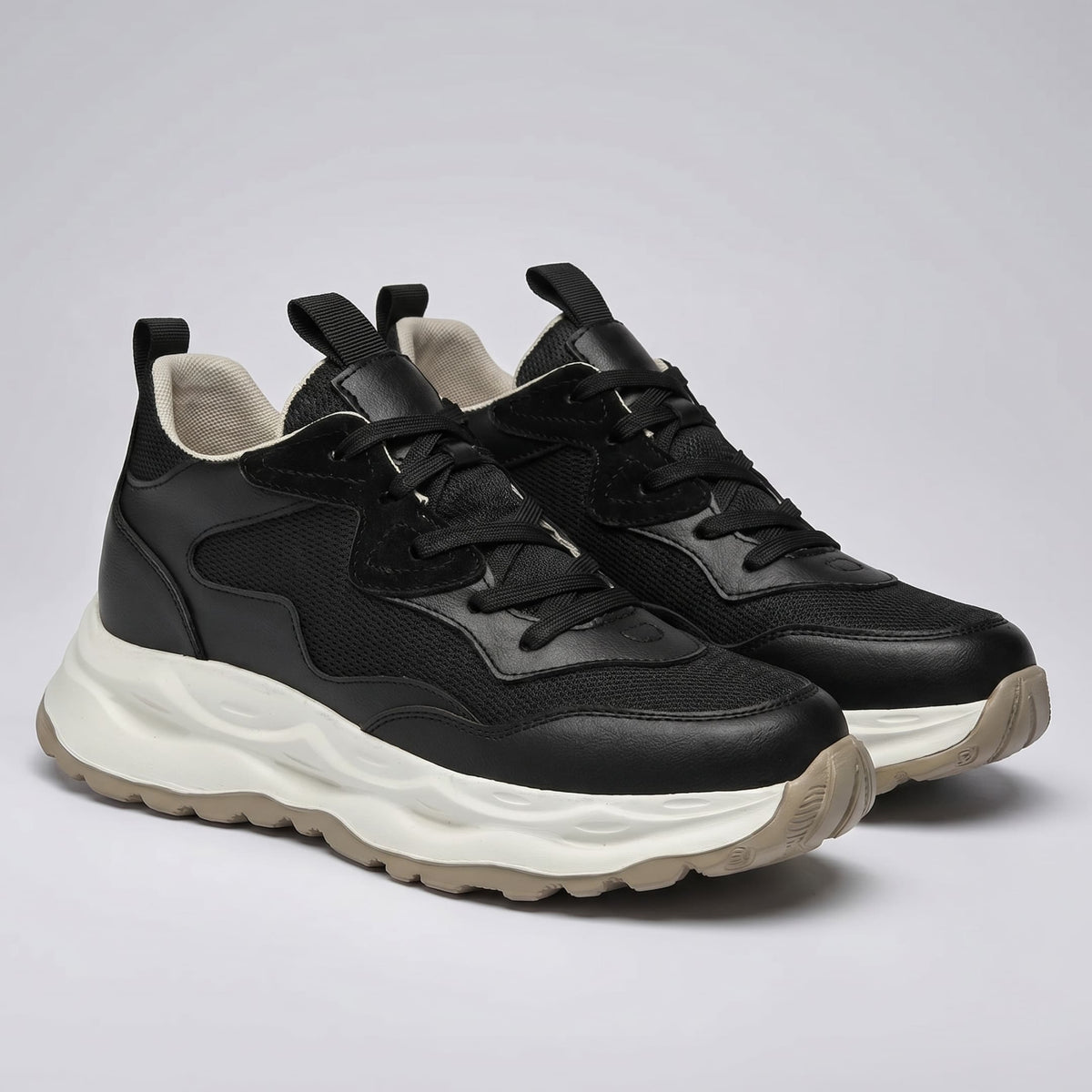 FORCIANO BELLE leather sneakers for women in black, shown as a front three-quarter pair with premium leather upper and contrasting white sole.