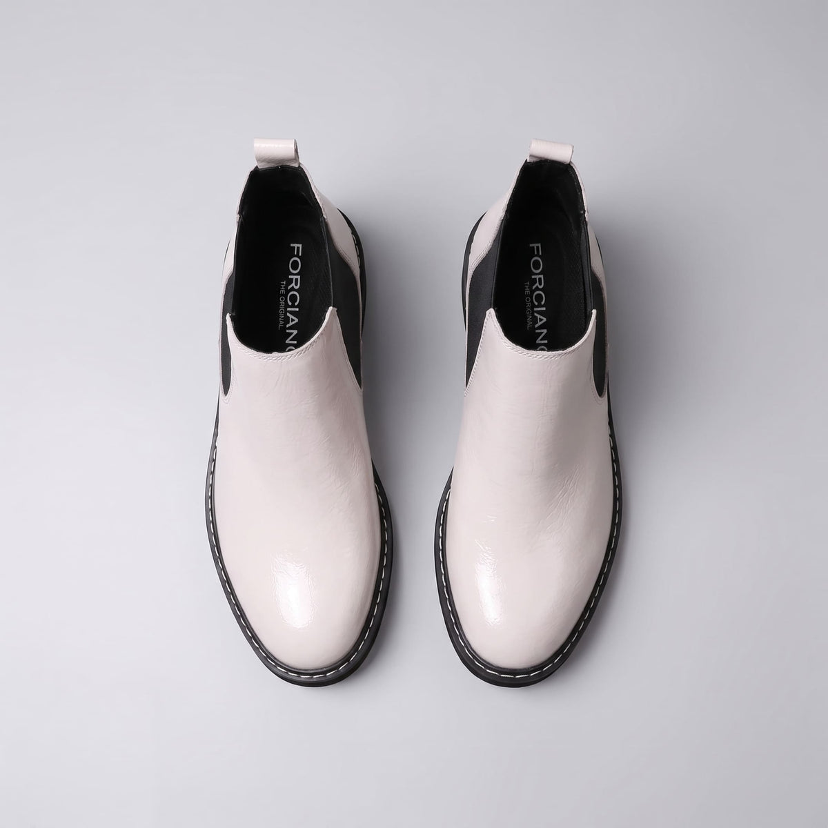 FORCIANO BRIXTON white women's elevator boots shown as a pair from above, with premium leather uppers, black interiors and side elastic inserts.