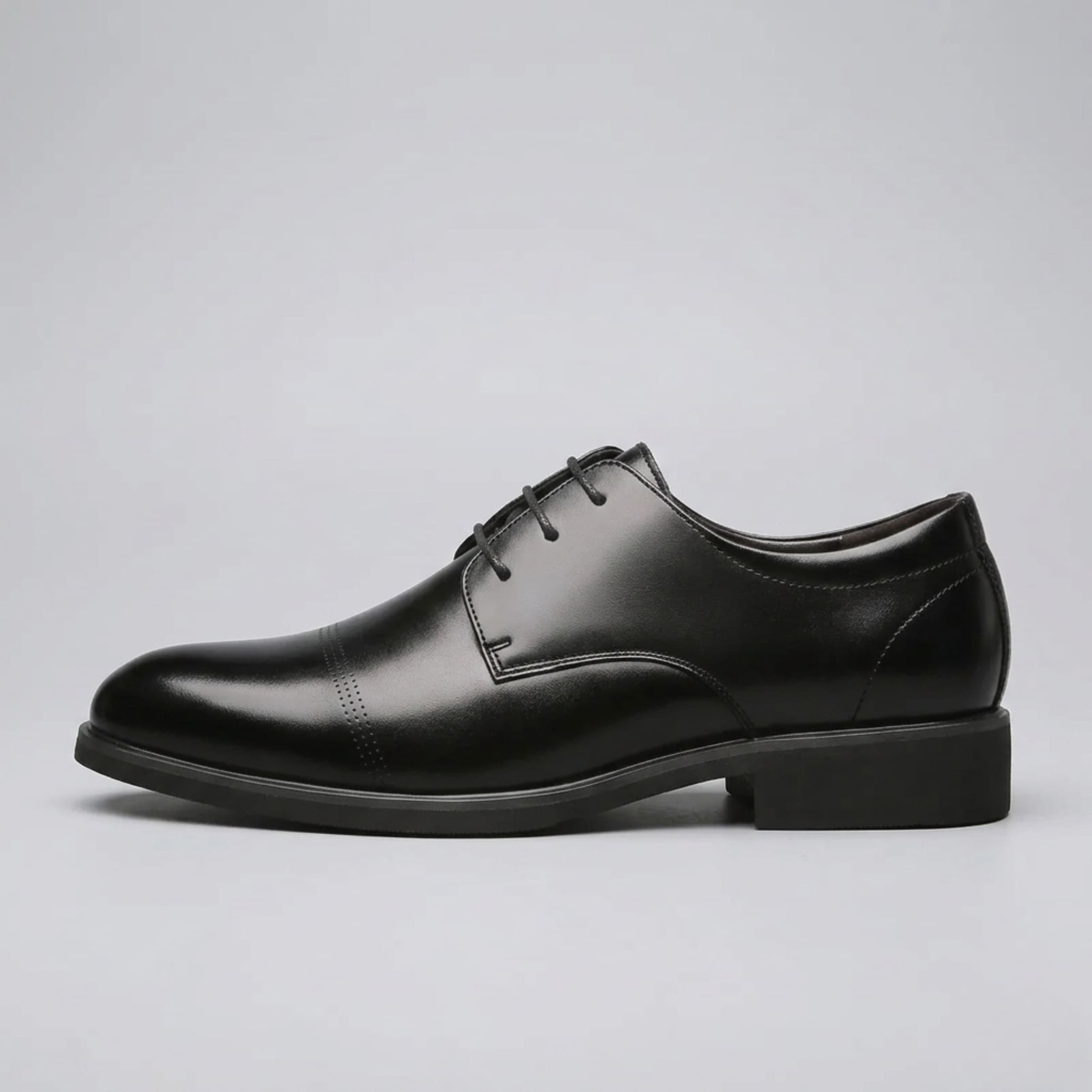 Side profile of a FORCIANO CAVELLO black elevator dress shoe with premium leather upper, lace-up front and polished Oxford finish.