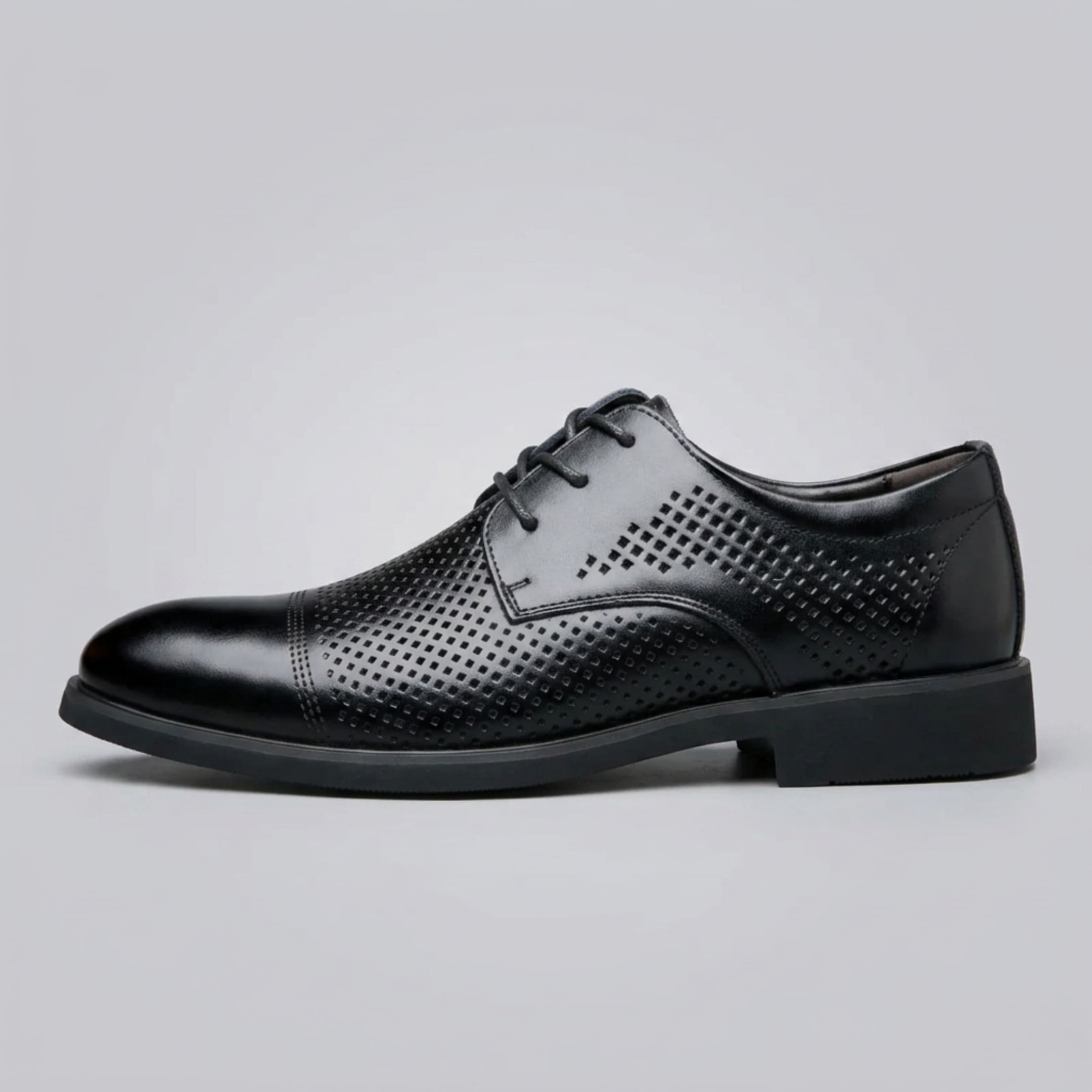 Side profile of a FORCIANO CAVELLO black perforated elevator dress shoe with premium leather upper and patterned perforated panels.