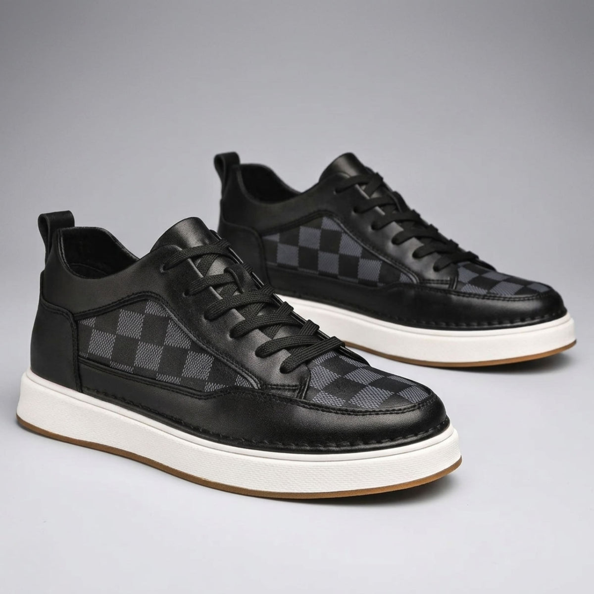 FORCIANO CELESTE black women's sneakers shown as a pair from a front three-quarter angle with premium leather uppers and patterned panels.
