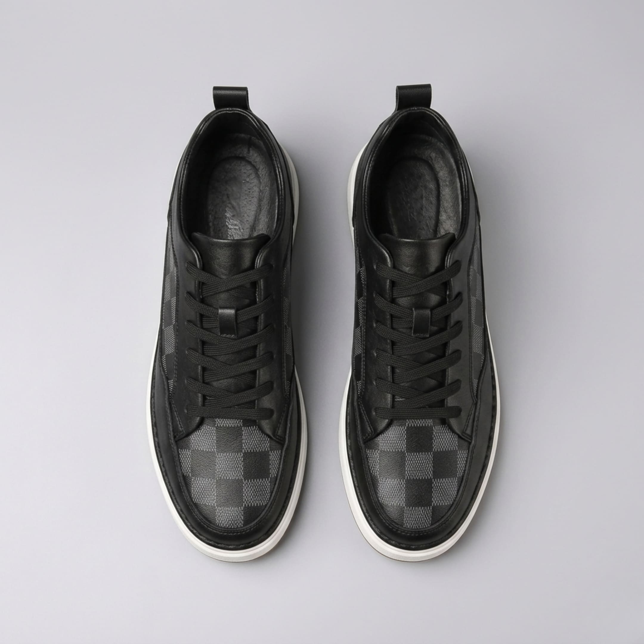 FORCIANO CELESTE black women's platform sneakers shown as a pair from the top with premium leather uppers, black laces and check-pattern toe panels.