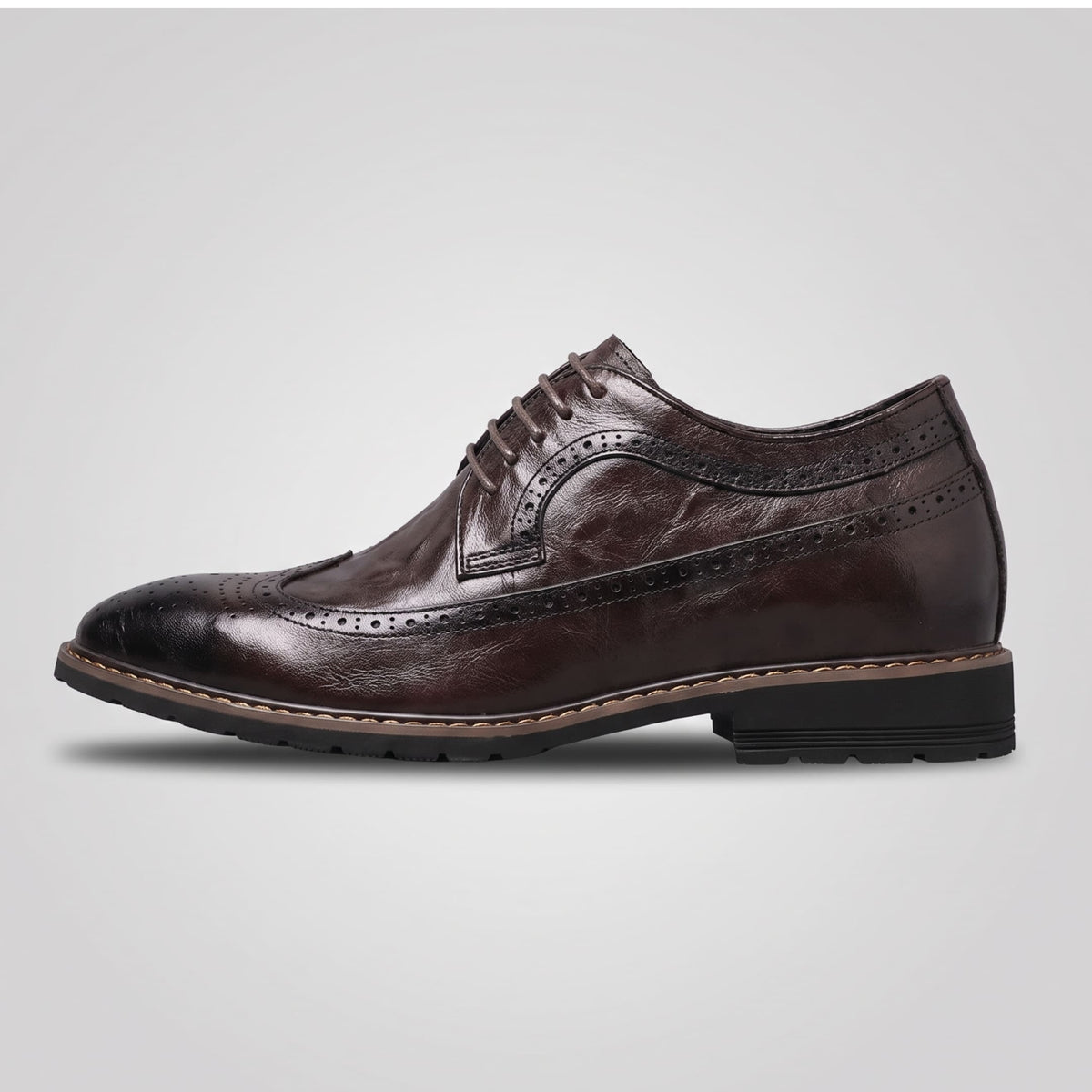 FORCIANO CELSUS Elevator Dress Shoes in brown premium leather shown from the side with decorative perforated detailing.