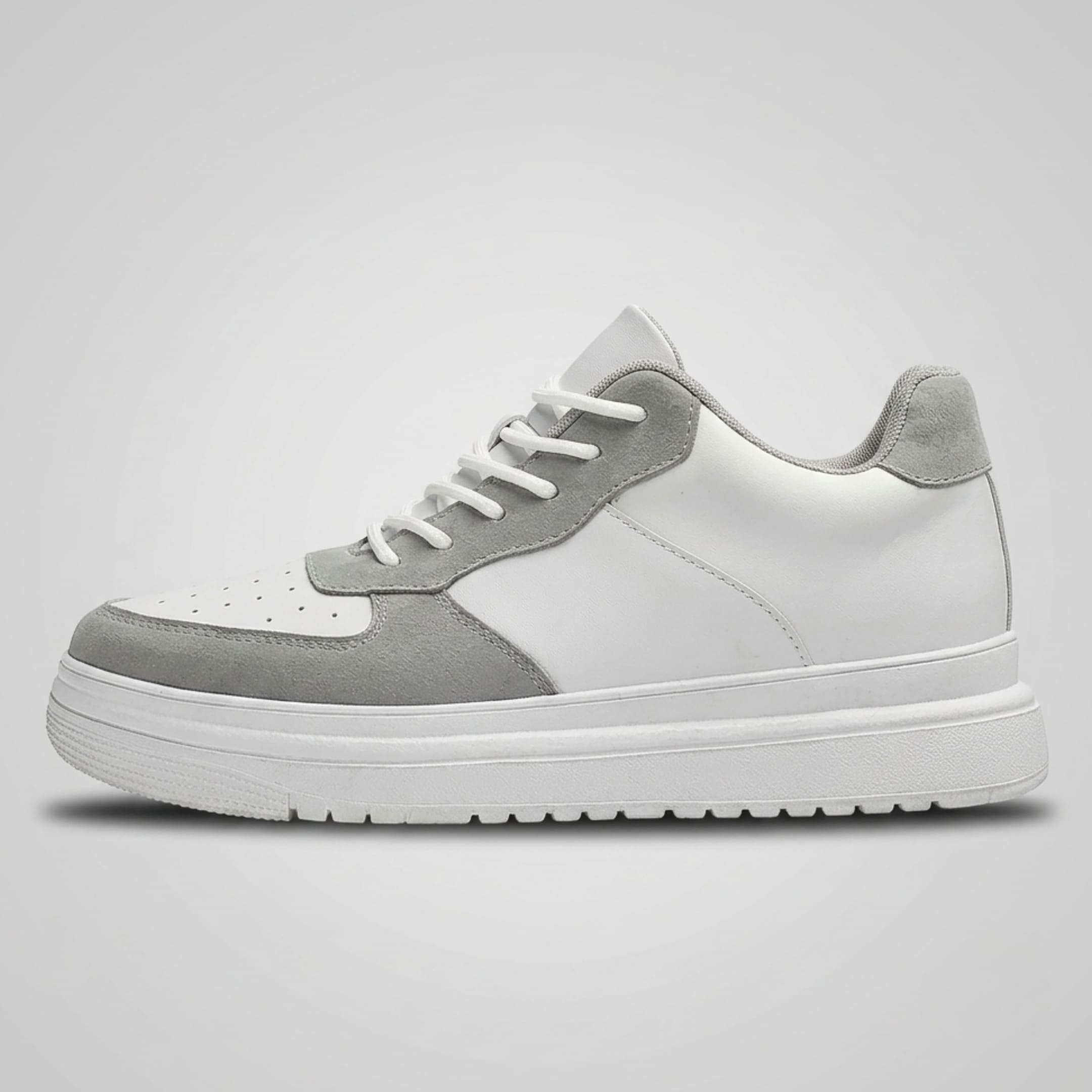 FORCIANO CHAMPION white and gray sneaker shown in a clean side profile with lace-up front, perforated toe panel, and raised sole.