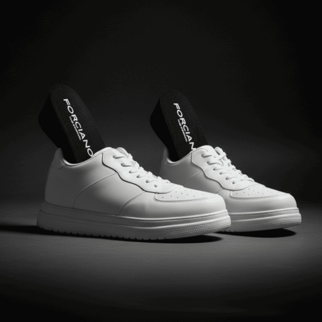 FORCIANO CHAMPION white height increasing sneakers shown as a pair in a dark studio setting with black FORCIANO lift inserts visible.