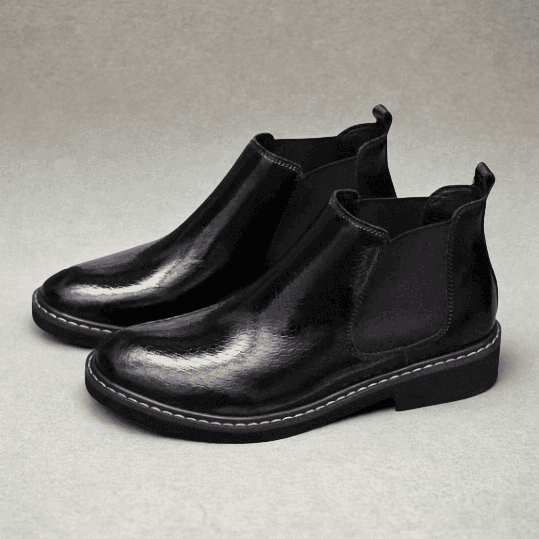 FORCIANO CROXTON black textured leather elevator Chelsea boots shown as a pair from a front three-quarter angle.