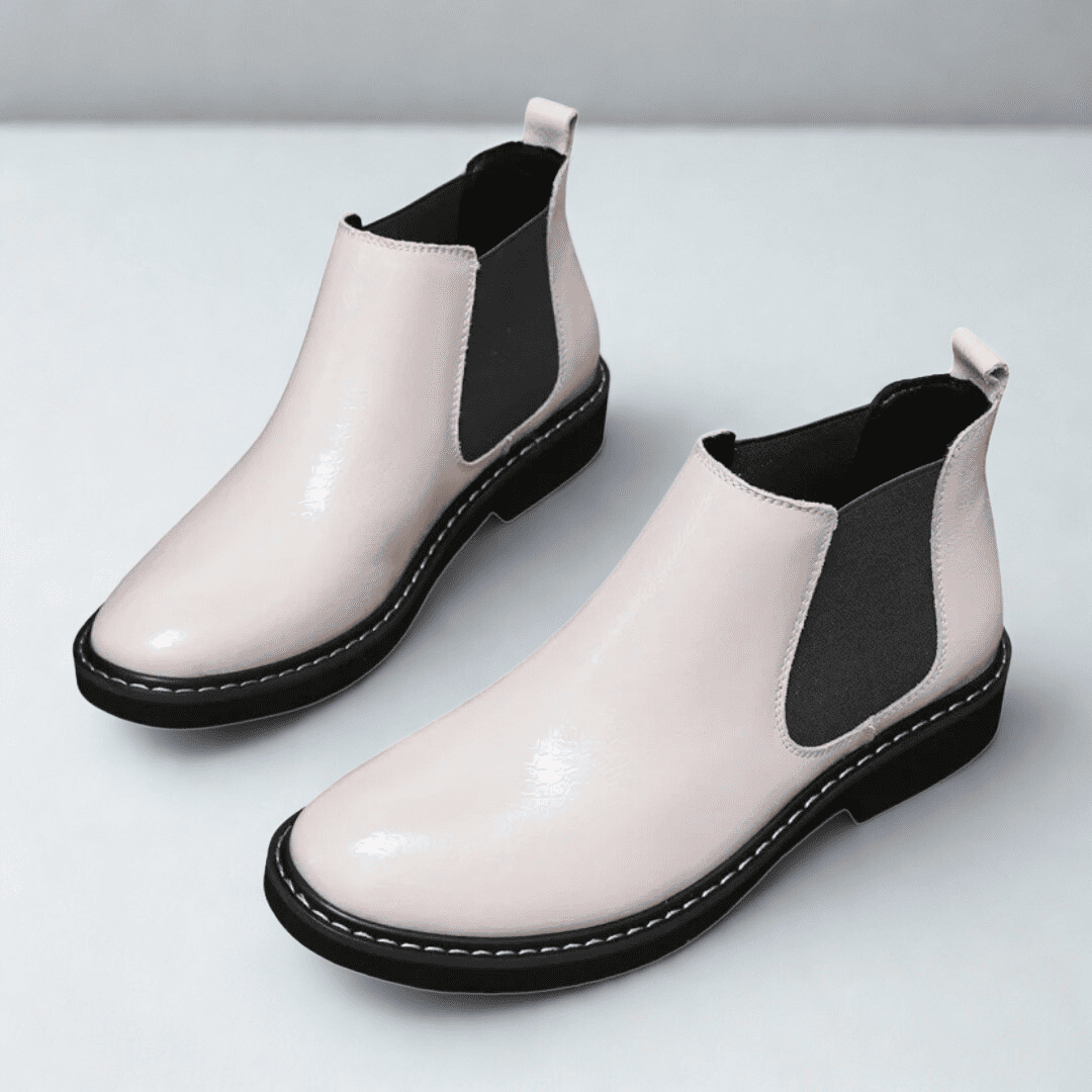 FORCIANO CROXTON white leather elevator boots shown as a pair from an elevated front three-quarter angle with black elastic panels.