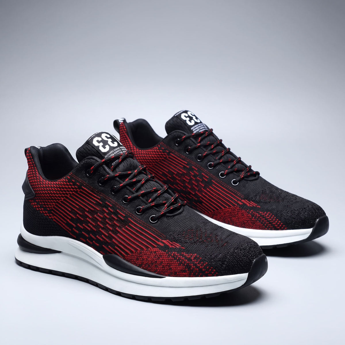 FORCIANO EDGE red and black Height Increasing Sneakers displayed as a pair from a front three-quarter view with white soles and breathable material.