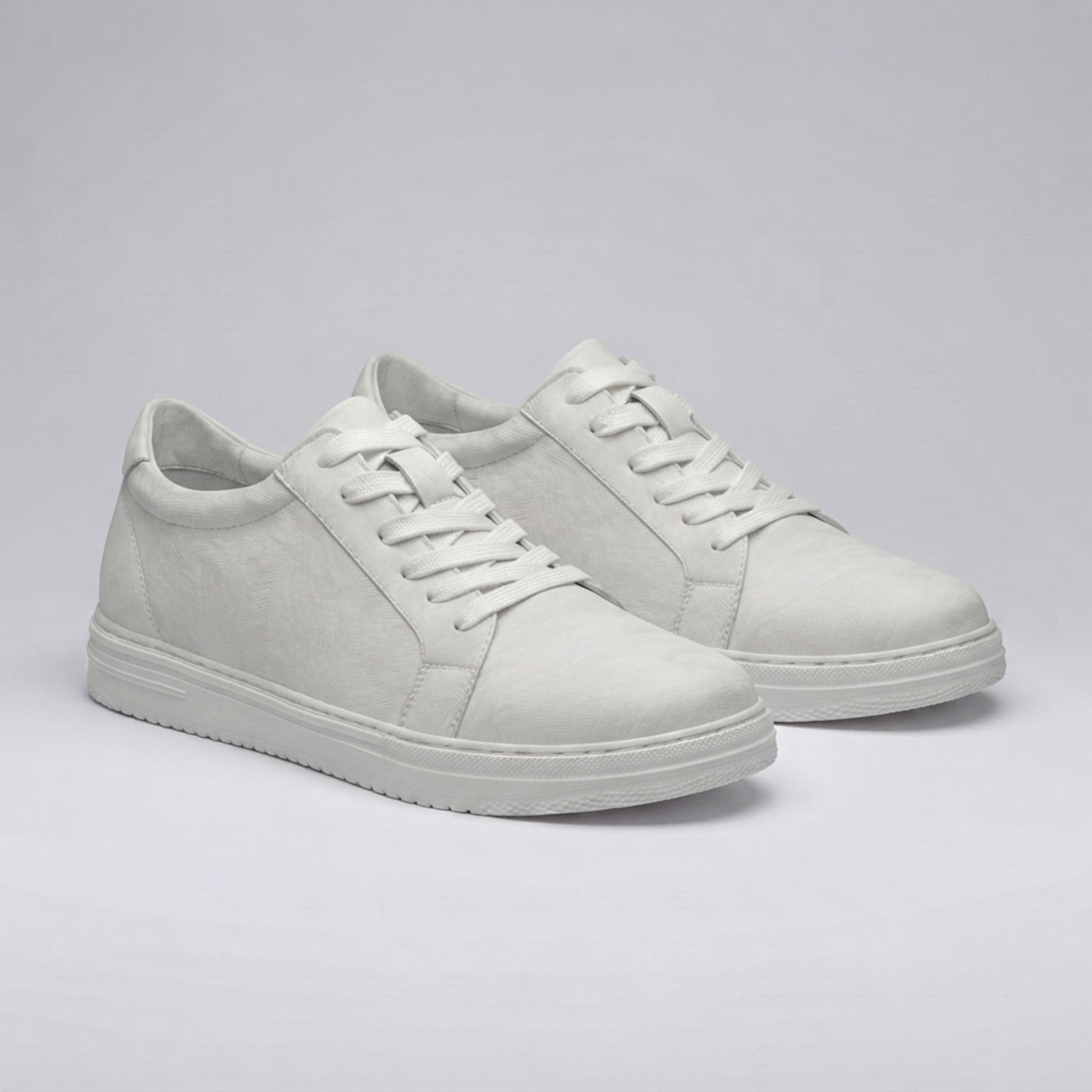 Pair of FORCIANO ELEMENT white Height Increasing Sneakers shown from a front angled view with premium leather uppers, white laces, and white soles.