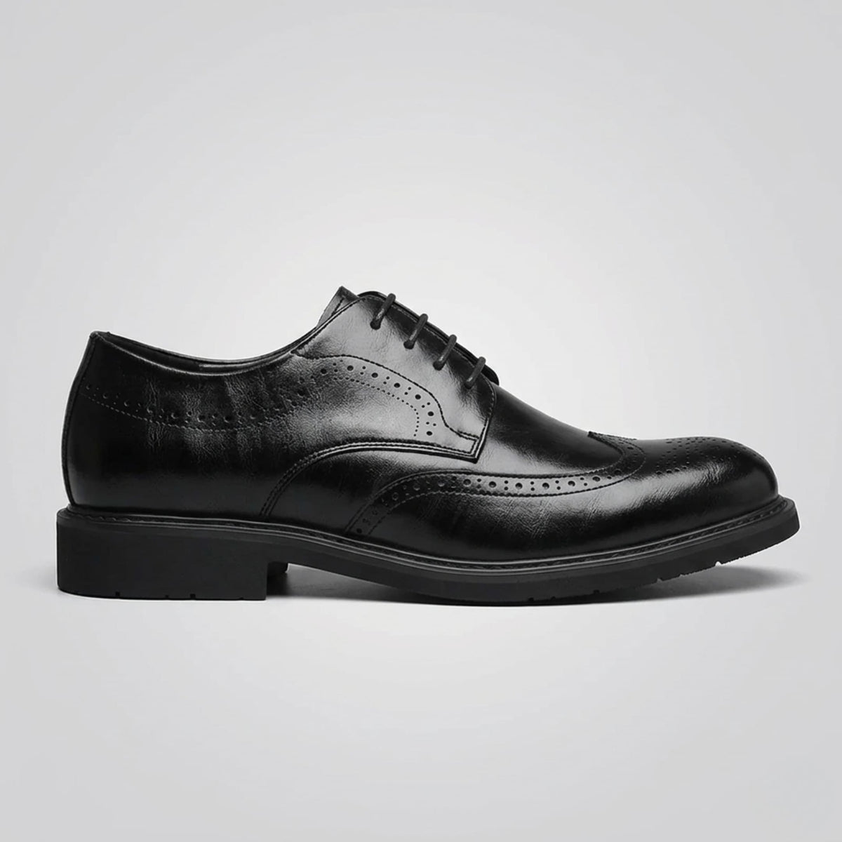 FORCIANO FAIRMONT black height increasing dress shoes shown in a full side profile with lace-up closure and brogue detailing.