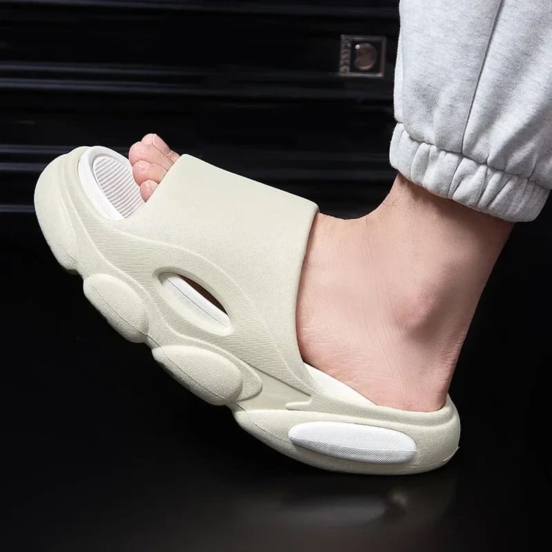 FORCIANO FEROX Beige-White ultra-soft EVA height increasing slippers shown on foot in a close side view.