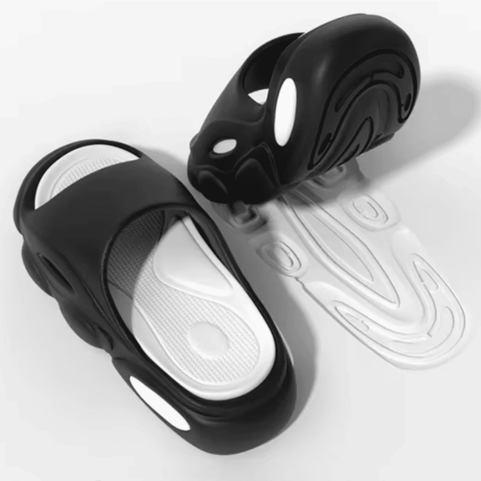 FORCIANO FEROX Black-White height increasing slippers shown as a pair with the white cushioned footbed and patterned outsole visible.