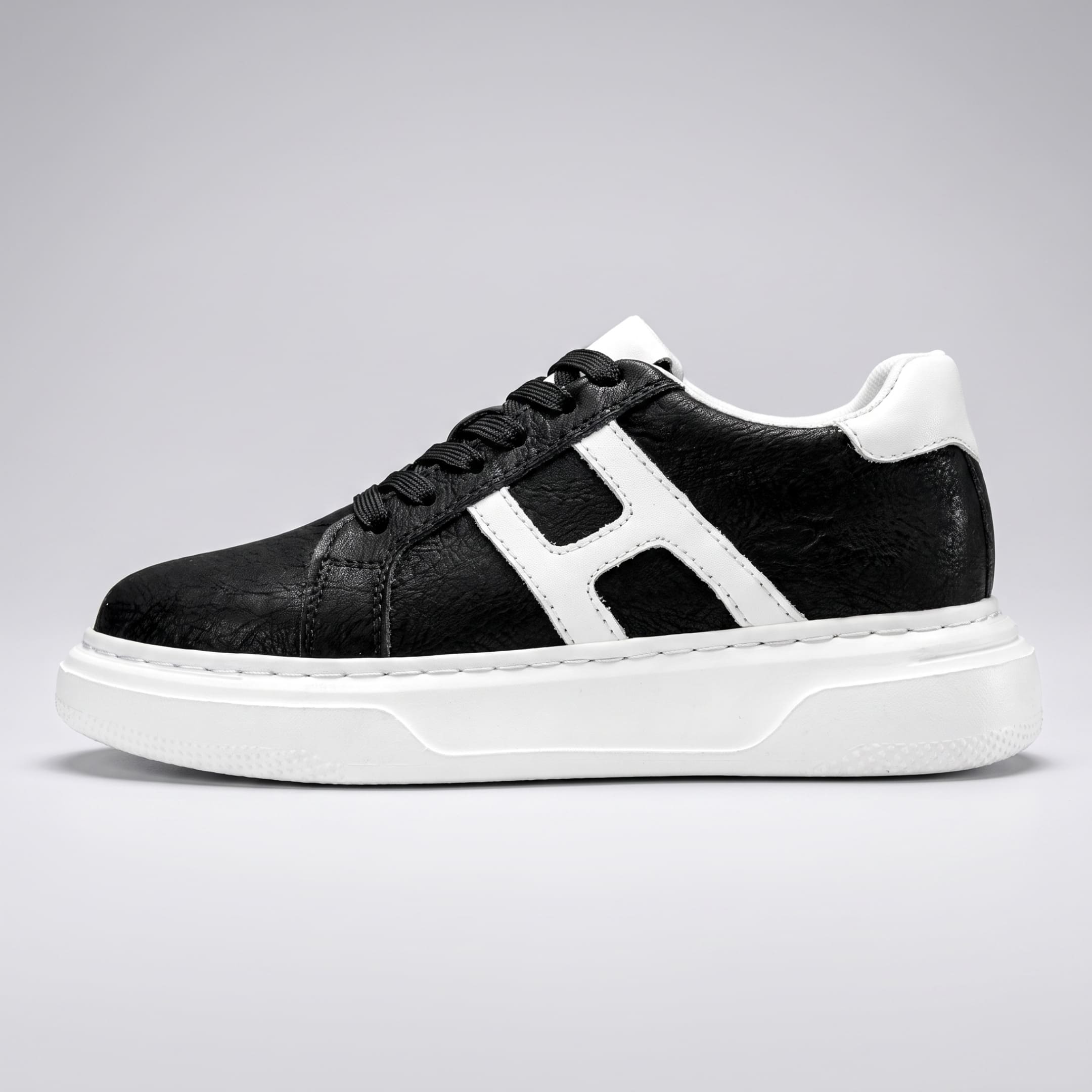 FORCIANO HERCULES black premium leather Height Increasing Sneaker shown in full side profile with white side accent and white sole.