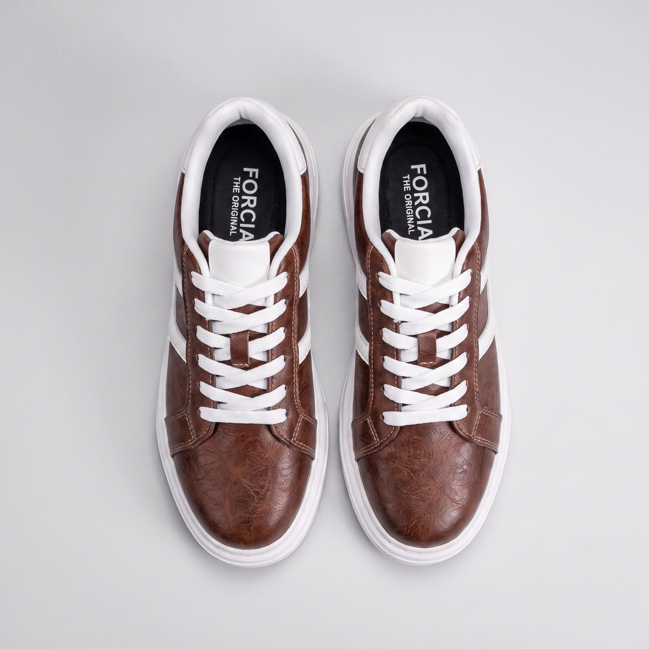 Top view of FORCIANO HERCULES brown premium leather Height Increasing Sneakers showing the pair, white laces, white accents, and black insoles.