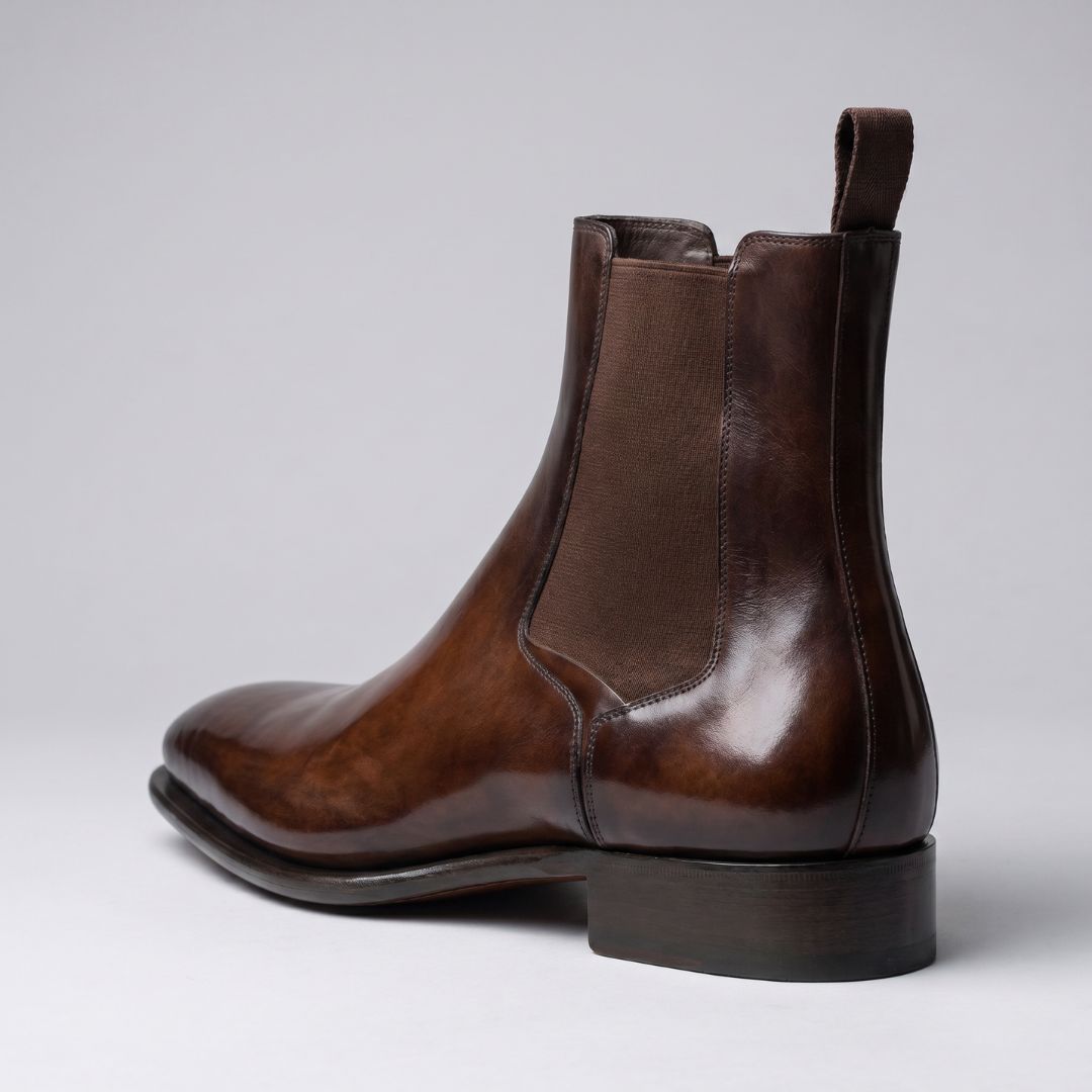 FORCIANO LUXOR brown leather elevator Chelsea boots shown from the rear-side view with elastic panel and heel visible.