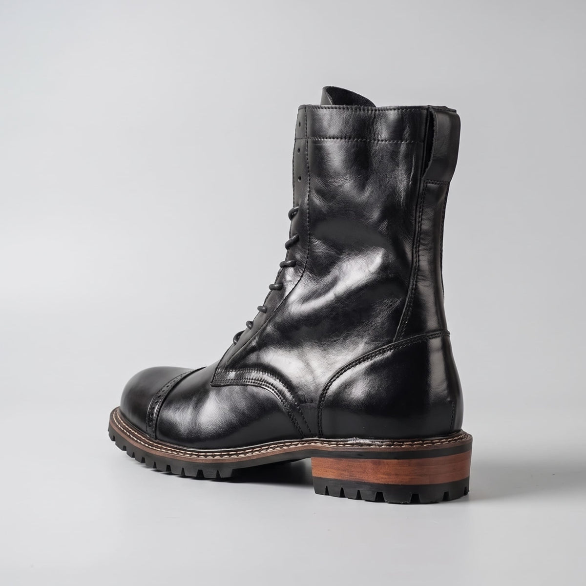 FORCIANO MARSHAL black height increasing boots with genuine leather upper shown from the rear three-quarter angle.