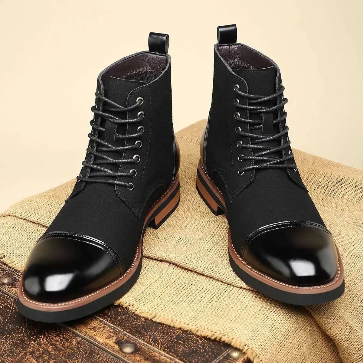 Pair of FORCIANO MERIDIAN black Elevator Boots shown from the front, with lace-up shafts and glossy black cap toes.