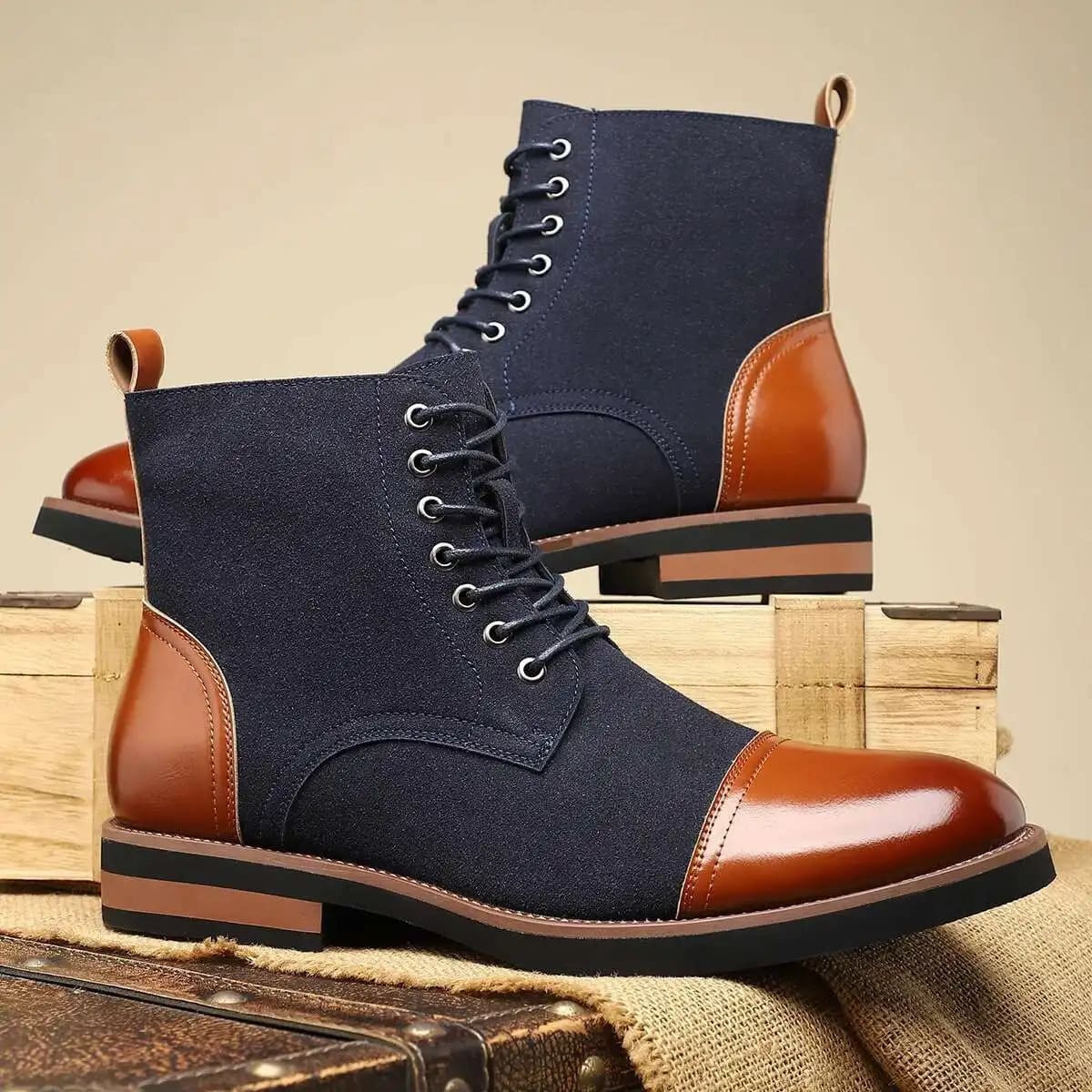 FORCIANO MERIDIAN dark blue elevator boots with brown accents, shown as a pair in front three-quarter and side views.