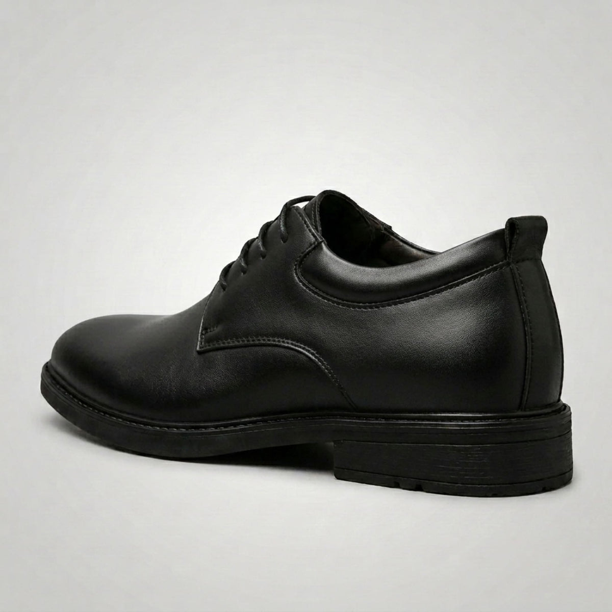 FORCIANO MOMENTUM black Elevator Dress Shoes shown from a rear side angle with the heel and lace-up design visible.