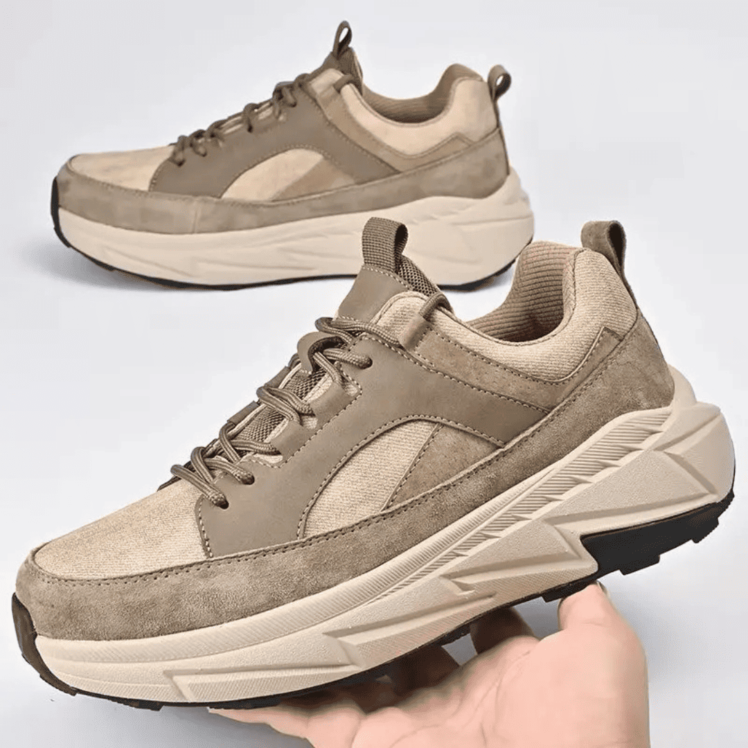FORCIANO NORTHRIDGE beige height increasing sneakers shown as a pair, with one held in hand from a front three-quarter angle.