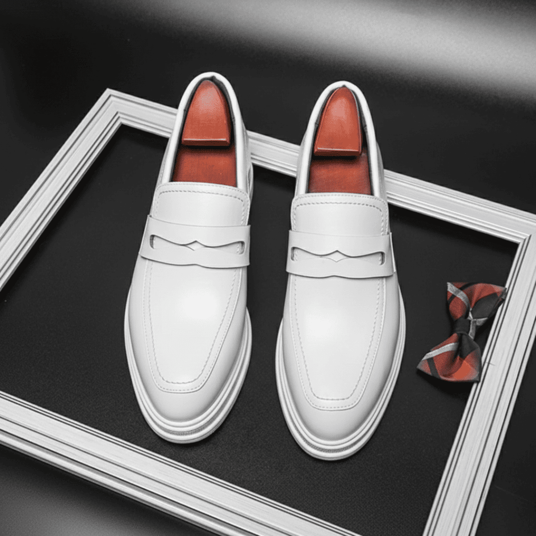 FORCIANO PANTHERA white leather elevator loafers shown side by side from a top view with the loafer straps clearly visible.