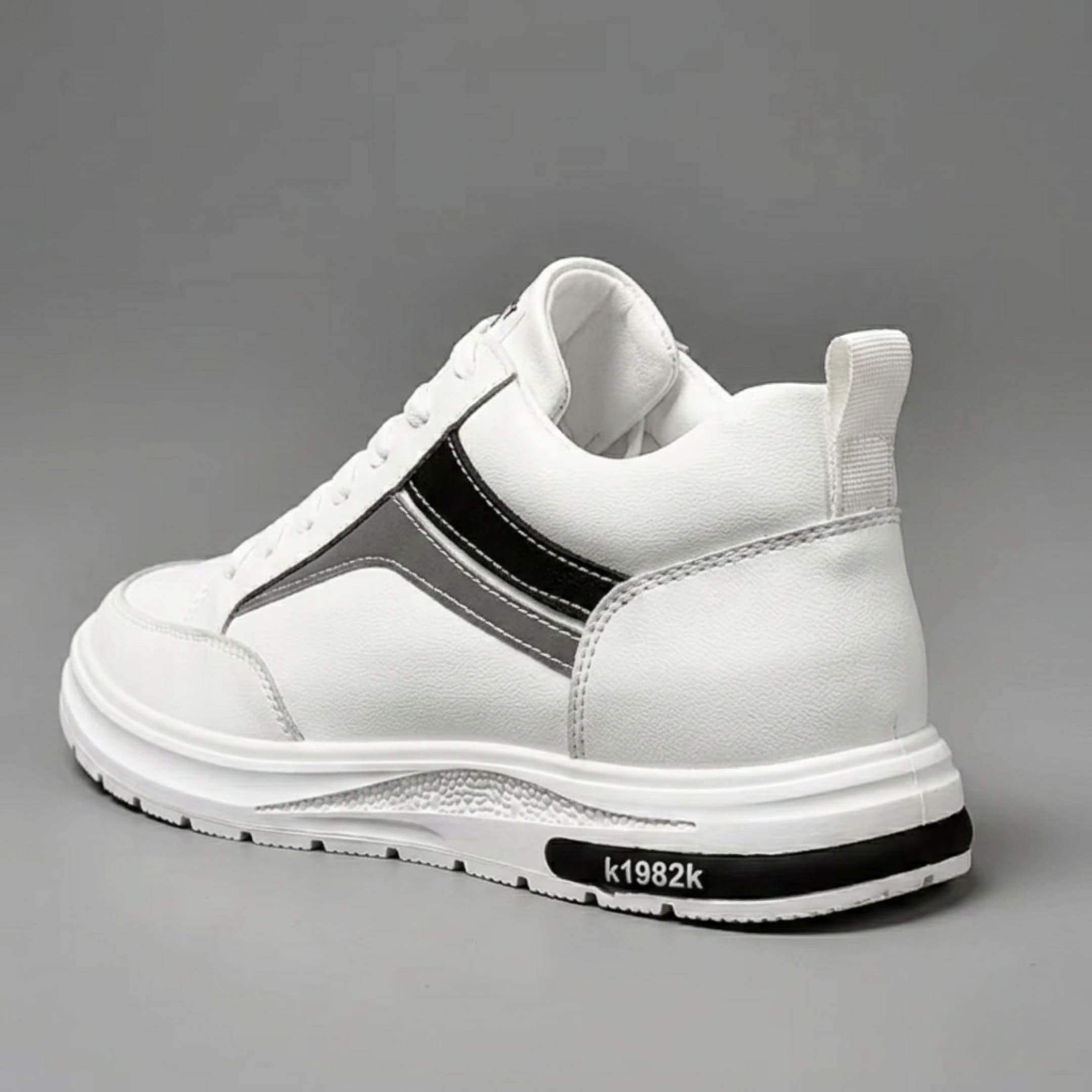 FORCIANO PRIME white height increasing sneakers with black and gray reflective accents shown from a rear three-quarter angle, highlighting the heel and side profile.