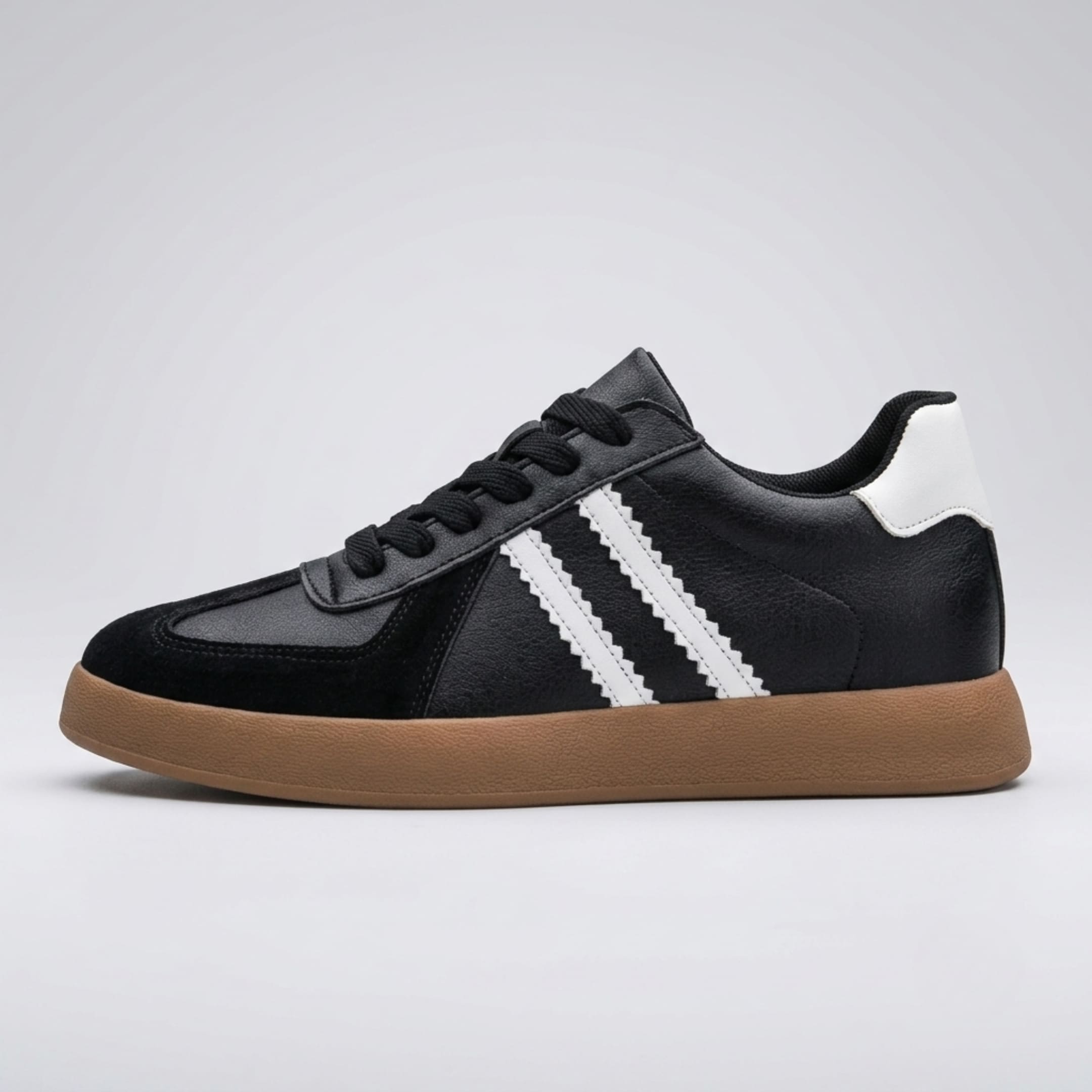 FORCIANO SABER black height increasing sneaker with white stripes, gum sole and split leather upper shown in a clean side profile.