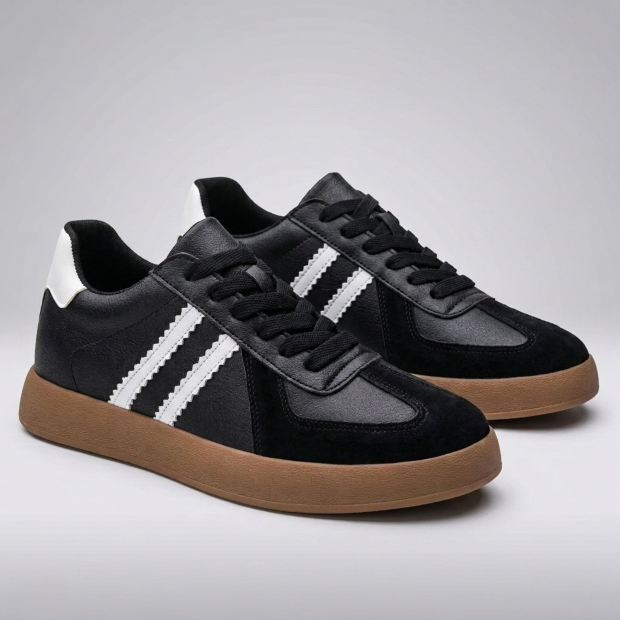 FORCIANO SABER black height increasing sneakers with white stripes and split leather uppers shown as a pair from a front three-quarter angle.