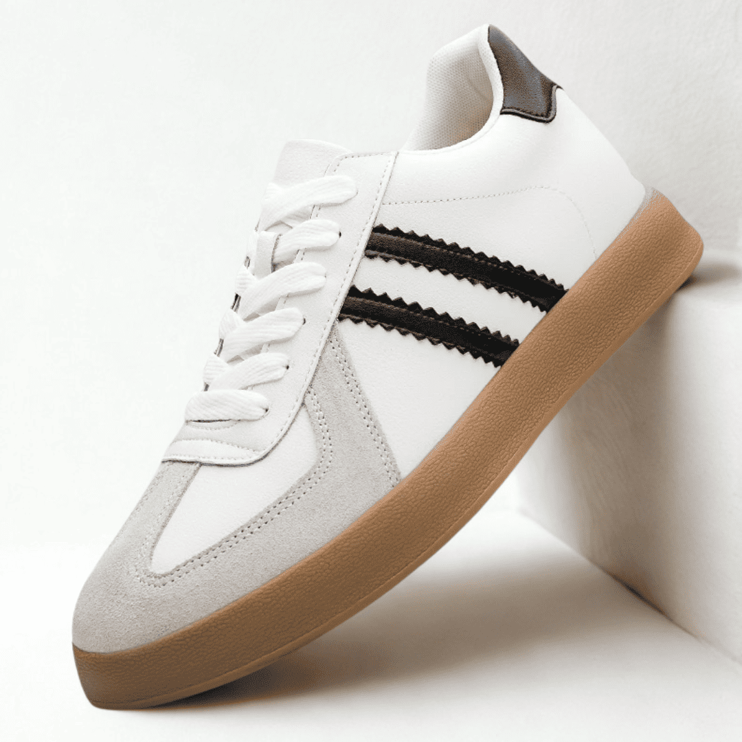 FORCIANO SABER white height increasing sneaker with black stripes, gum sole and split leather upper shown from an elevated front three-quarter angle.