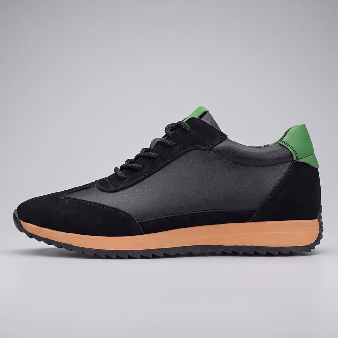 FORCIANO SALVATORE black height increasing sneakers with cow suede upper, green accents and tan midsole shown as a single shoe in side view.