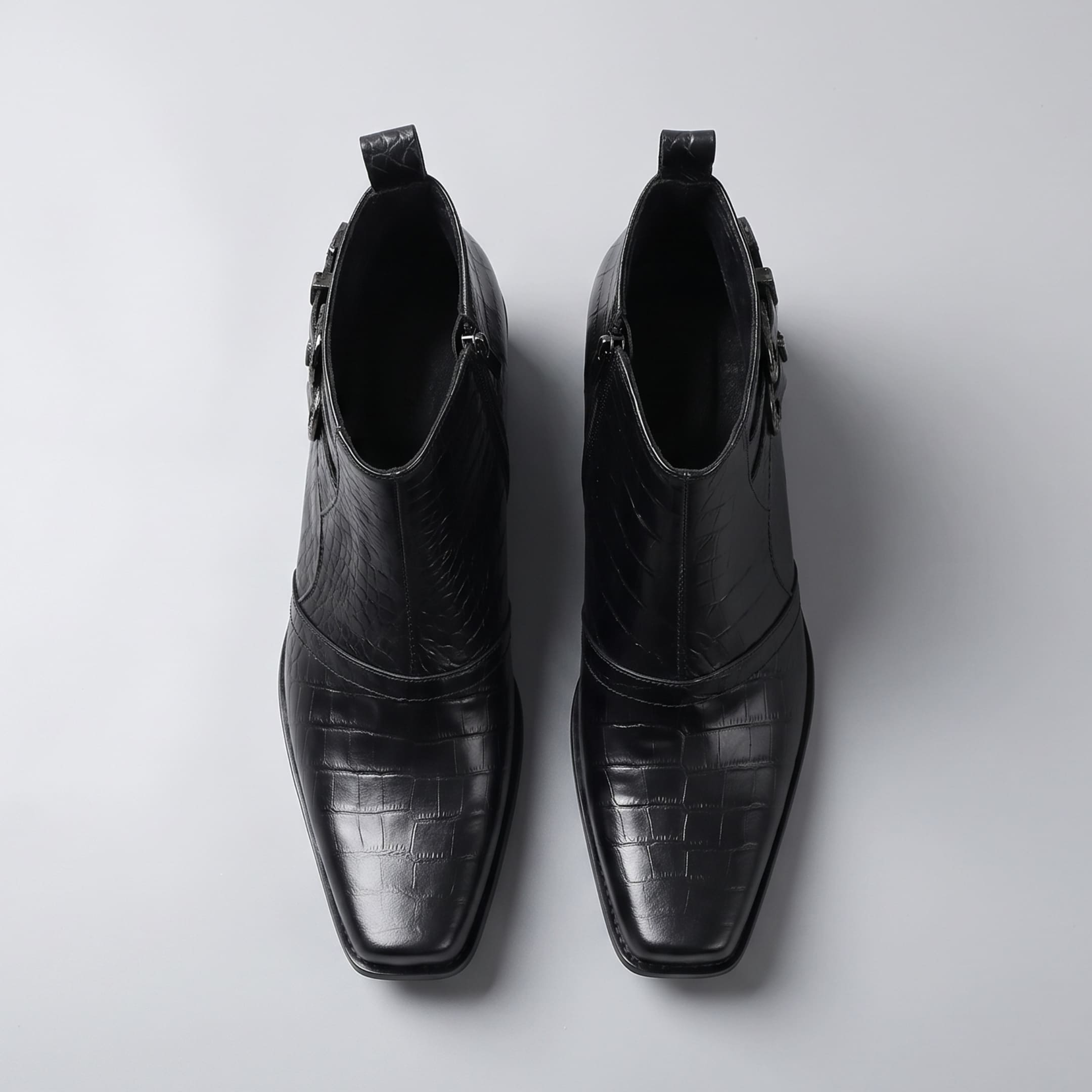 FORCIANO SCAROSSO black genuine leather height increasing boots in top view as a pair, showing textured uppers, square toes and side openings.