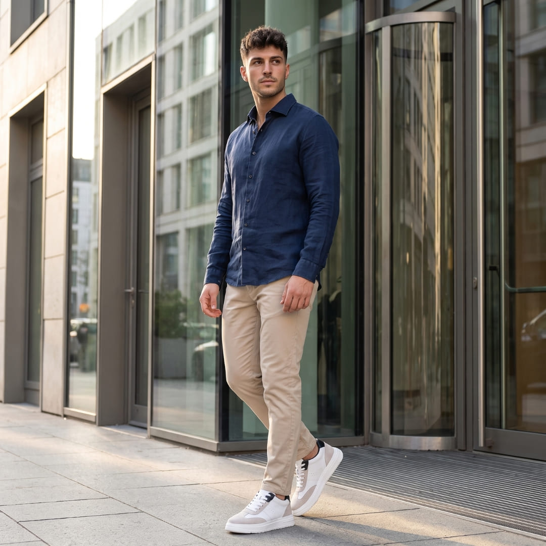 Man wearing white FORCIANO TORINO Height Increasing Sneakers with leather uppers in an outdoor lifestyle setting.