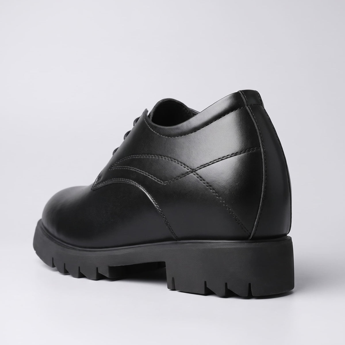 FORCIANO WINDSOR black Height-Increasing Shoes shown from the rear three-quarter angle, highlighting the leather upper, heel shape and sole profile.