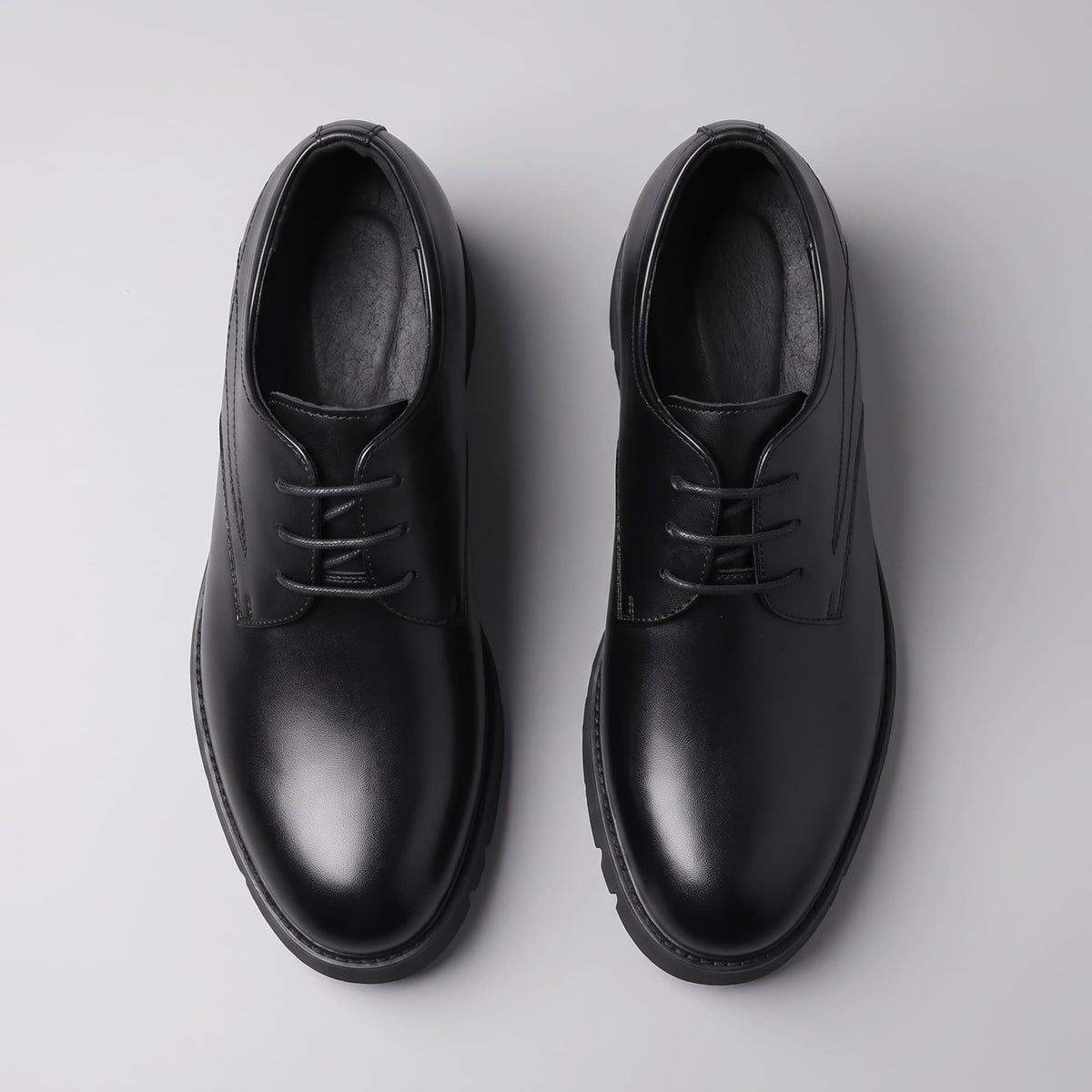 FORCIANO WINDSOR black Height-Increasing Shoes shown as a leather pair from the top view with rounded toes, laces and interior openings visible.