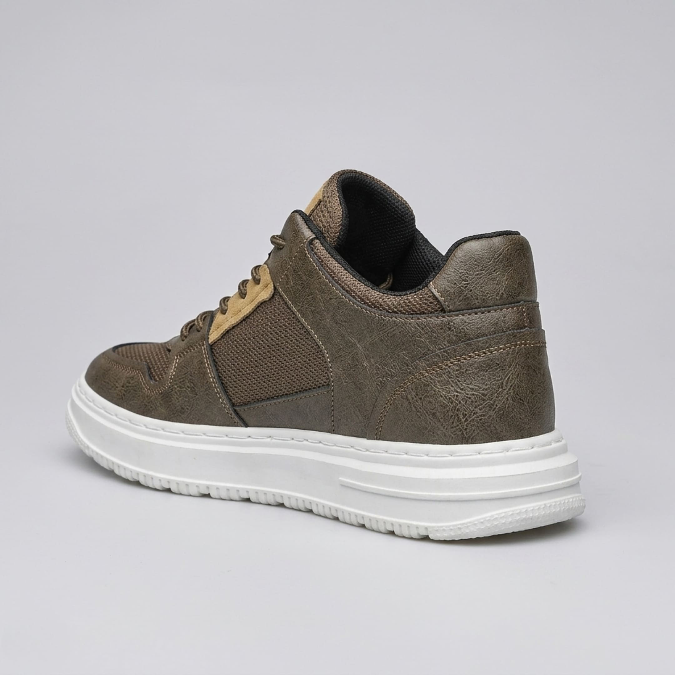 FORCIANO ZENITH brown sneaker with breathable air mesh upper shown from a rear three-quarter angle with the white sole visible.