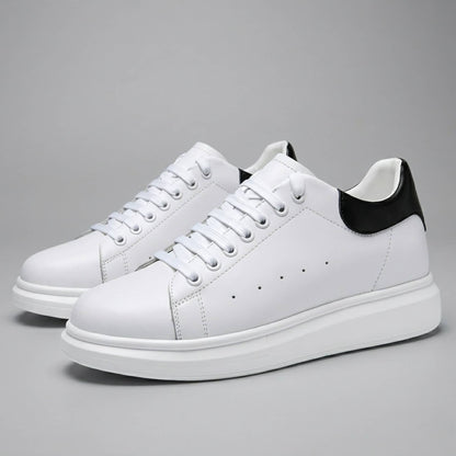 FORCIANO AURAS white elevator sneakers with leather upper, pair view on a grey background.