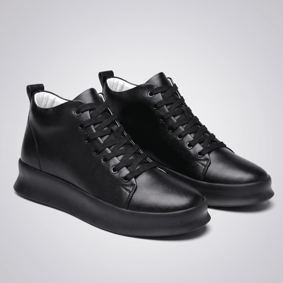 Pair of black FORCIANO ACHILLES Height Boosting Sneakers shown from a front three-quarter angle.