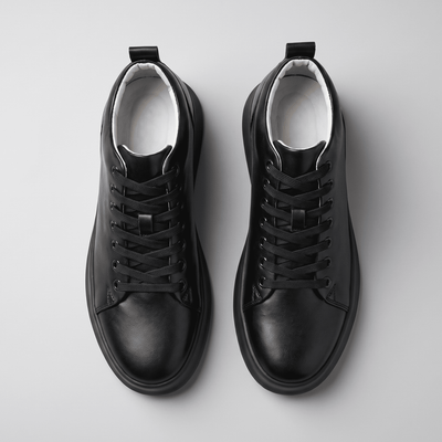 Pair of black FORCIANO ACHILLES Height Boosting Sneakers photographed from the top with laces and interiors visible.