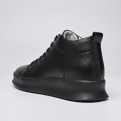 Black FORCIANO ACHILLES Height Boosting Sneakers shown from a rear three-quarter angle with heel detail visible.