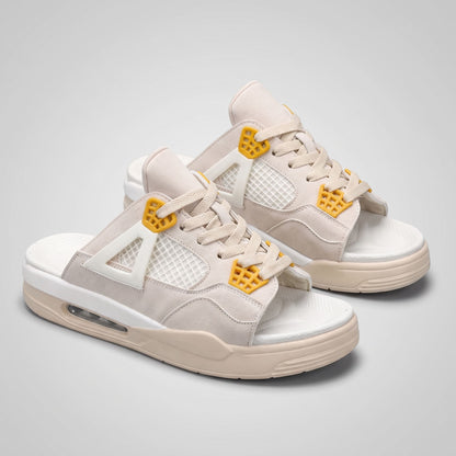 Pair of beige FORCIANO AERO Height Increasing Slippers shown from a front three-quarter angle with yellow lace accents.