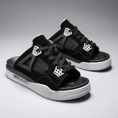 Pair of black FORCIANO AERO Height Increasing Slippers shown from a front three-quarter angle with white sole accents.