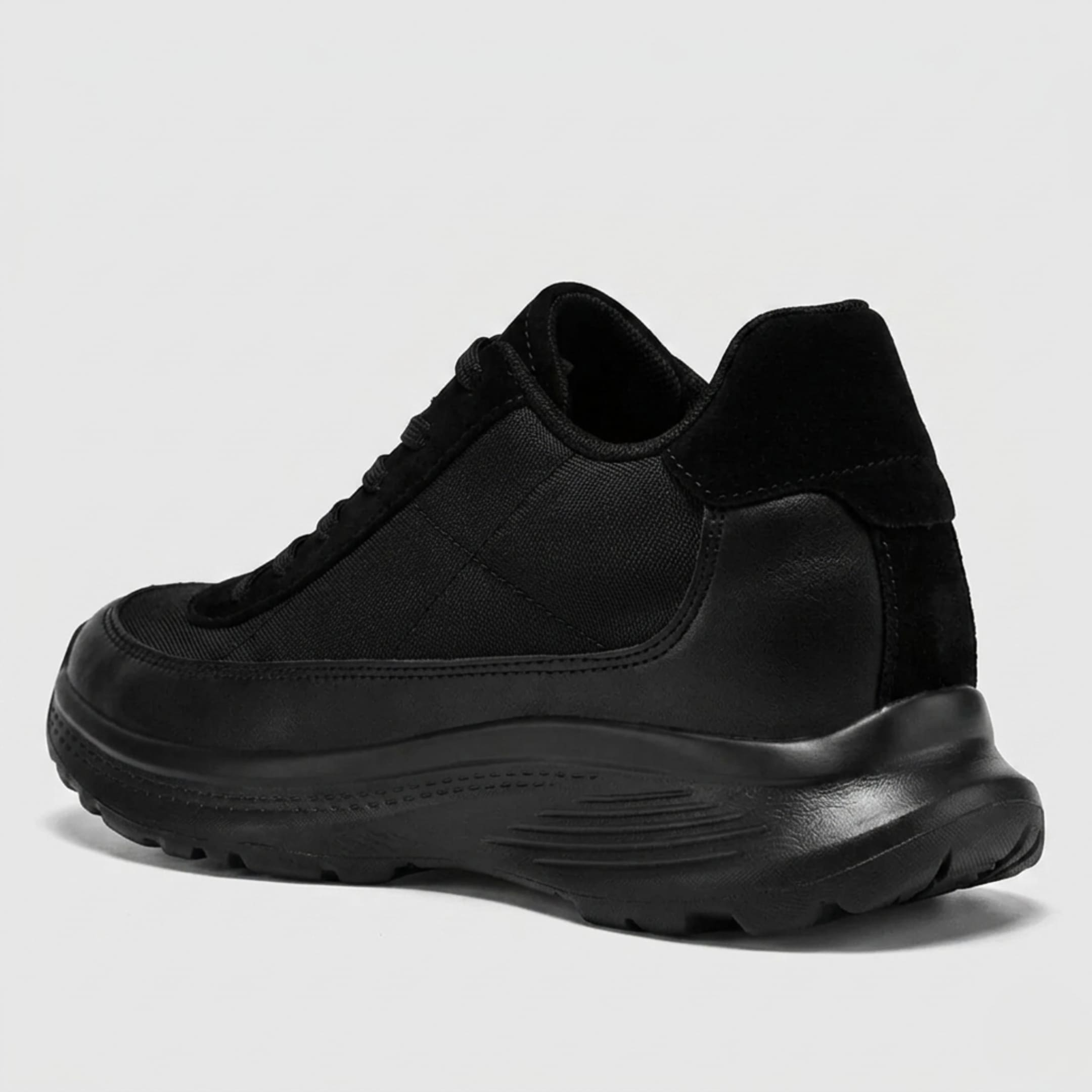 FORCIANO AEROX black height increasing sneakers with premium leather upper shown from a rear three-quarter side angle, highlighting the heel and sole profile.