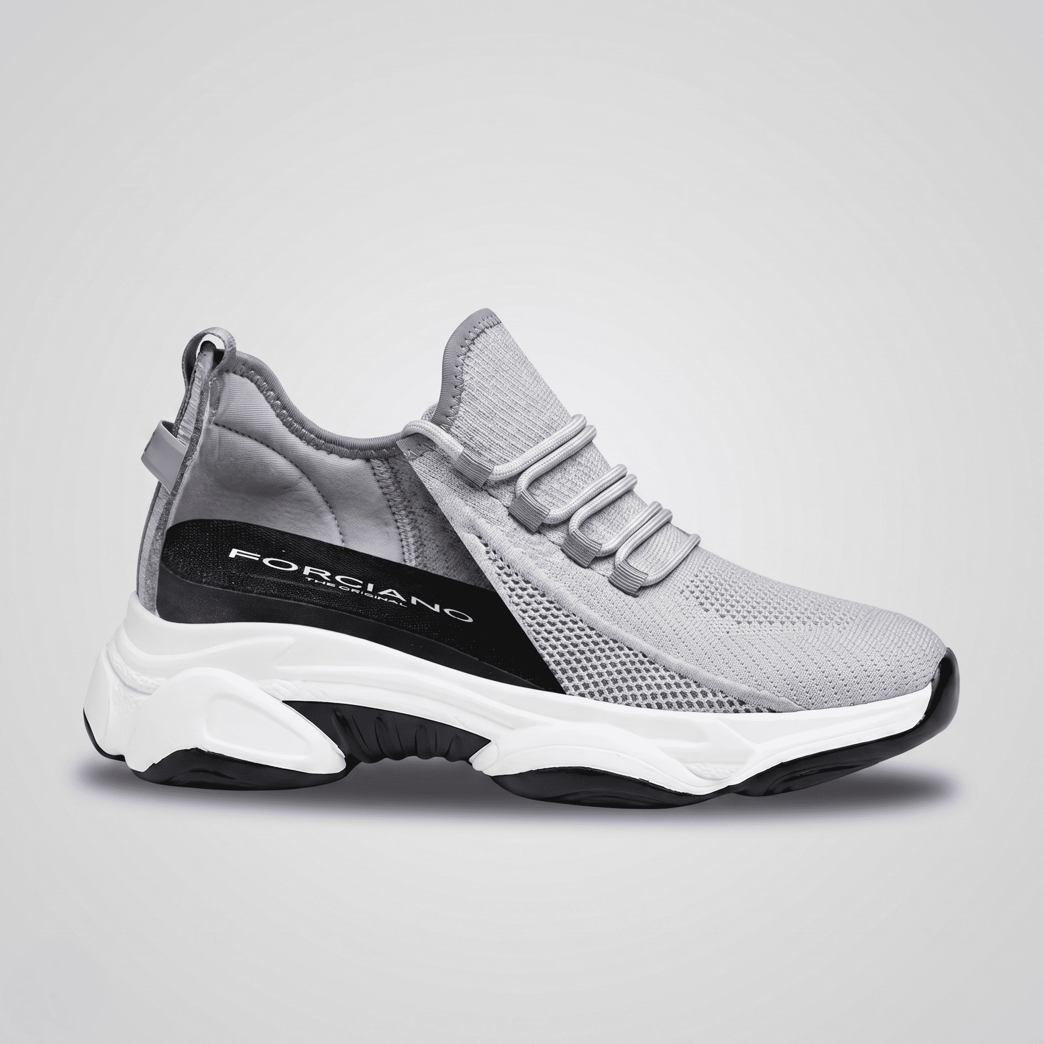 FORCIANO ALTITUDE gray height increasing sneaker shown from the side with the internal lift area visible