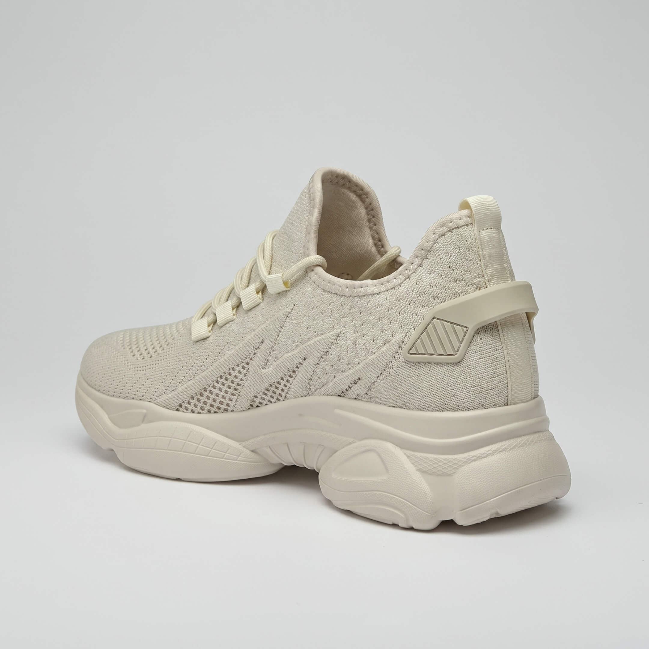 FORCIANO ALTITUDE beige elevator sneakers in rear side view, featuring breathable mesh material and a sculpted elevated sole.