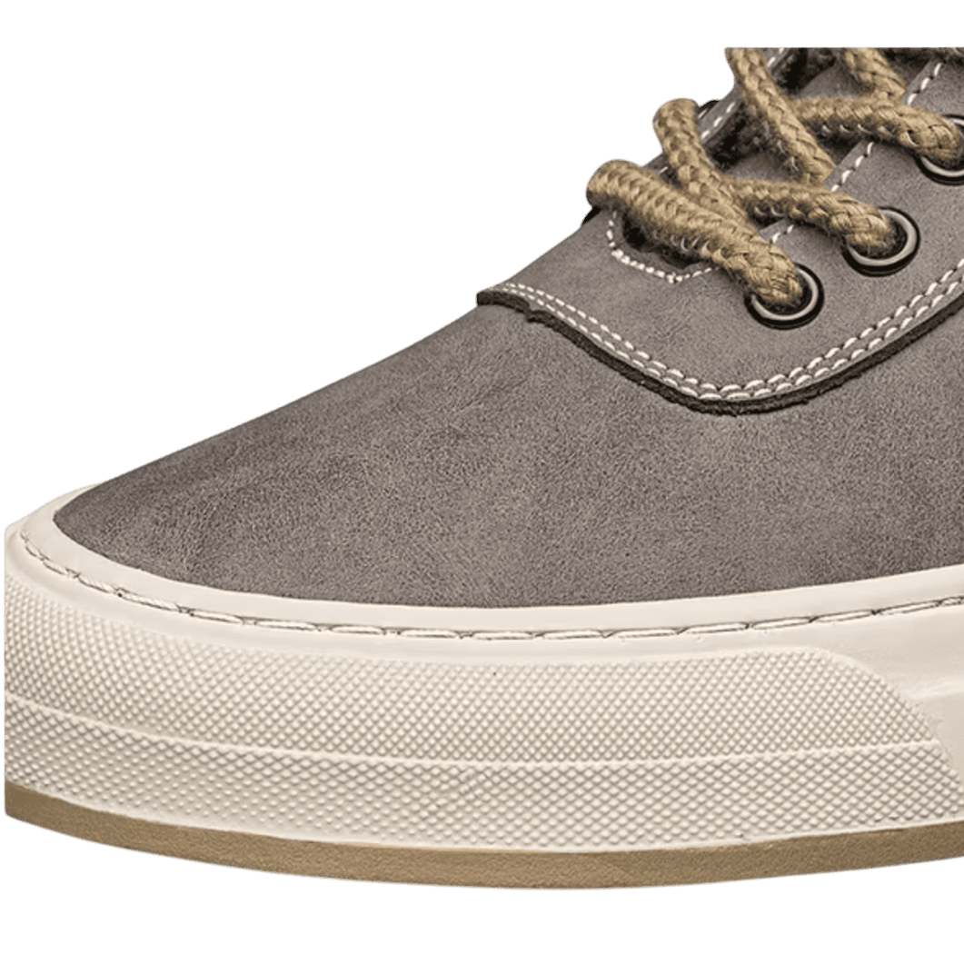 FORCIANO ASCEND gray premium leather sneaker close-up showing the toe, tan laces, metal eyelets, stitching, and cream sole.