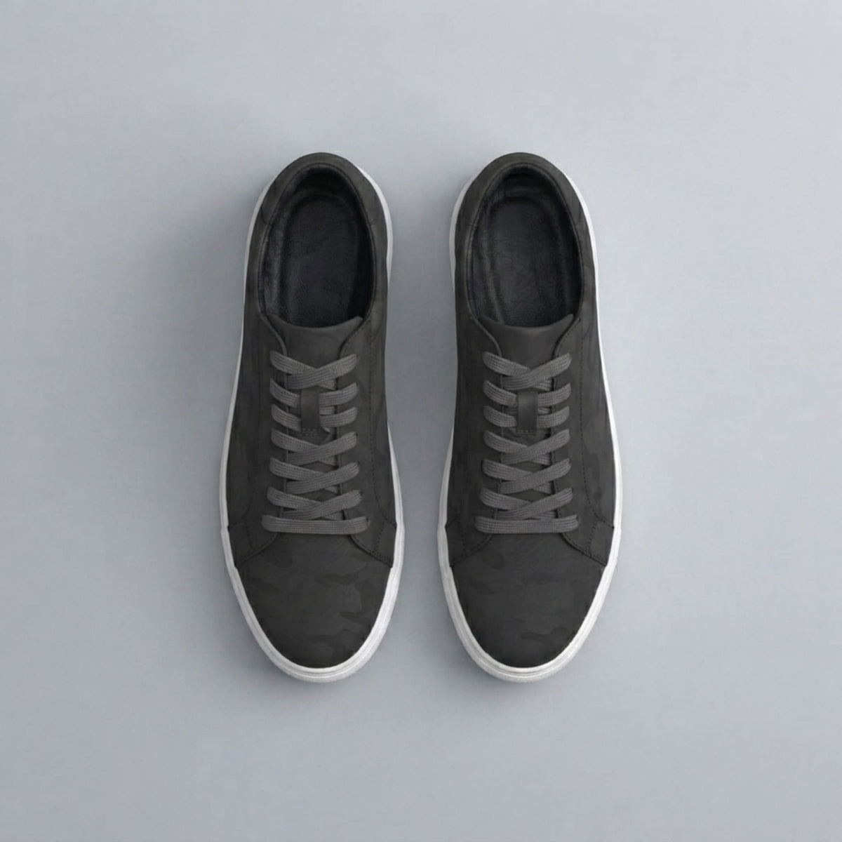 FORCIANO ATHENA black women's elevator sneakers displayed in a top-view pair with premium leather uppers, dark laces and contrasting white soles.