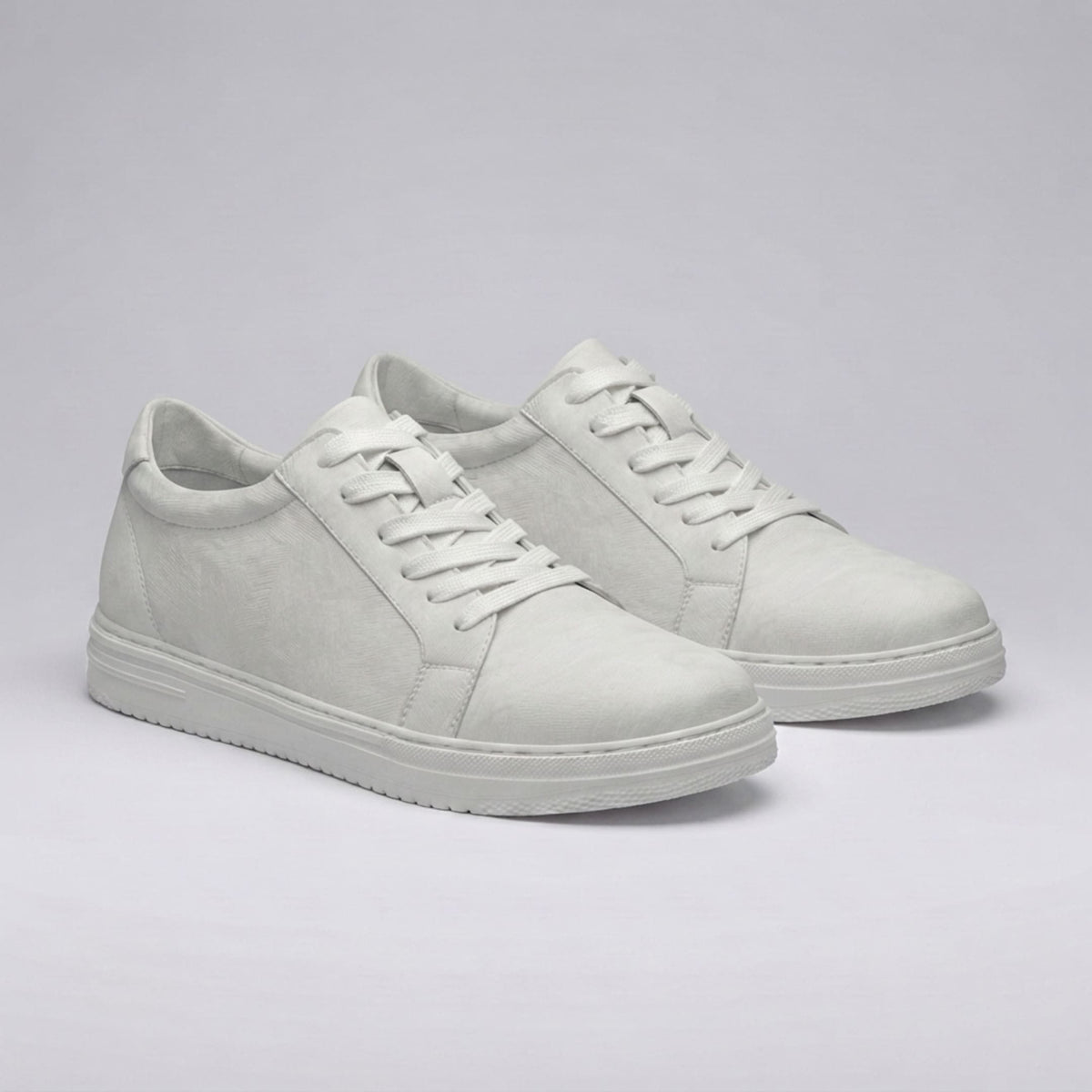 FORCIANO ATHENA white women's elevator sneakers shown as a pair in a front angled view, featuring premium leather uppers, tonal laces and white soles.